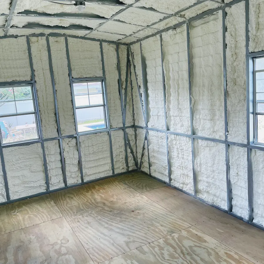 Closed-cell spray foam insulation applied to wall cavities in a residential project in Monitor